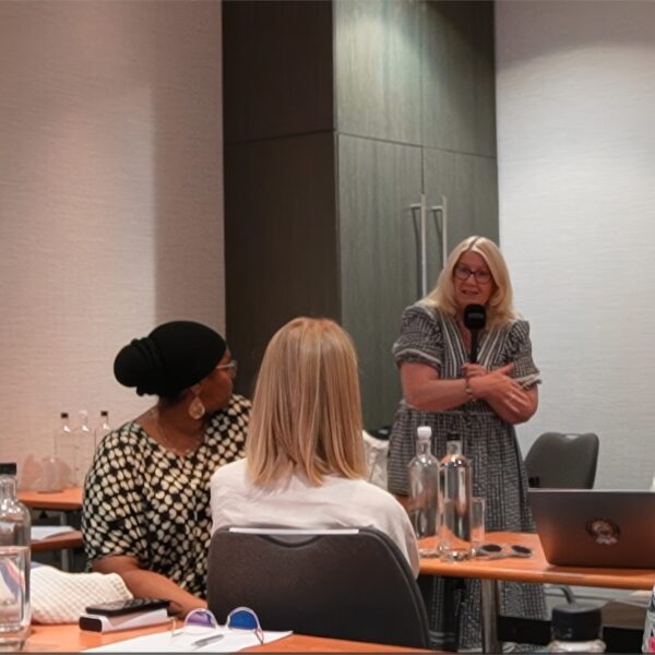 LCCHI lecturer engaging with students in the London classroom