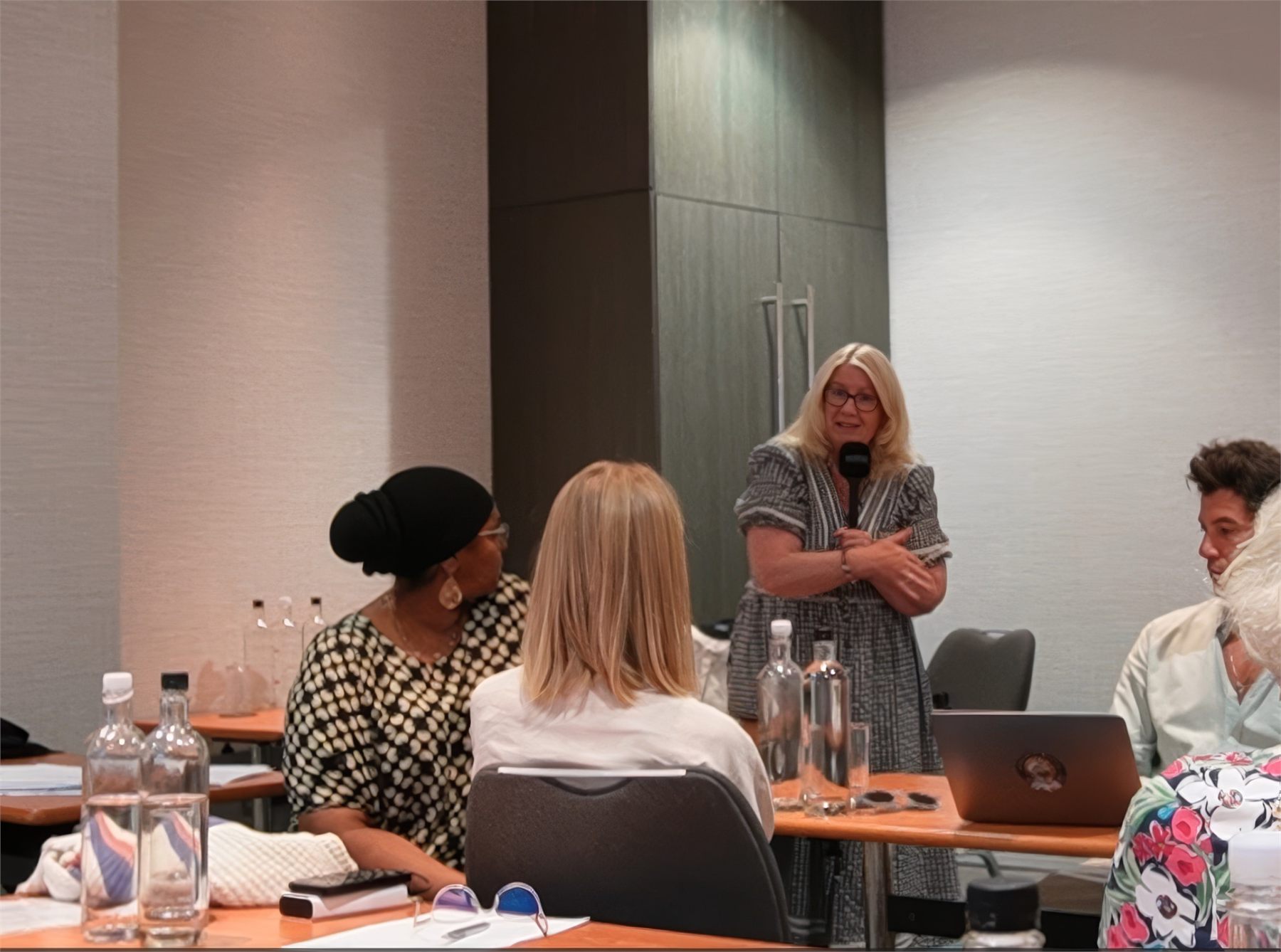 LCCHI lecturer engaging with students in the London classroom